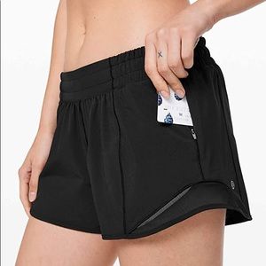 Size 4 Black Lululemon Low rise 4in Hotty Hot Shorts